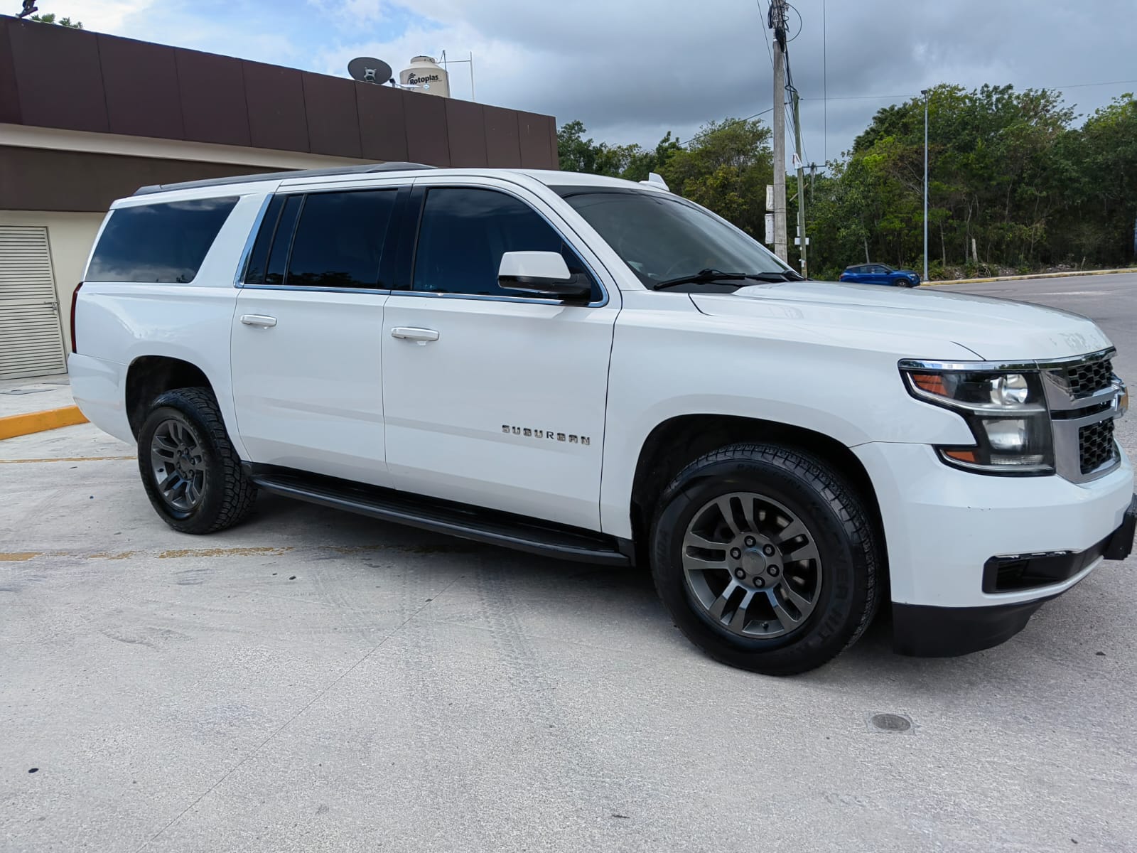Luxury vehicle parked at hotel entrance